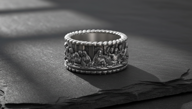 Side view of 925 sterling silver religious band ring with rope edge details and oxidized finish