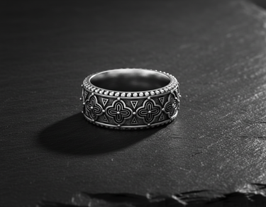 Side view of vintage style wide band ring showing beaded edges and oxidized silver finish