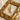 Close-up of the premium bird letter I pendant in gold vermeil elegantly displayed within a vintage golden frame.