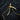 Gold plated scythe pendant variant displayed with chain on rustic black timber surface