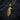 Gold tone eagle head pendant showing side profile and intricate plumage design