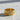 Detailed view of the intricately carved Aquarius water bearer and wavy line motifs on a flat band style ring