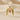 Gold plated version of bird initial pendant showing smooth polished finish and symmetrical design on silk
