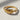 Close-up view of the handcrafted leaf vine ring resting on a bright surface, revealing precise veins and metalwork