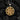 Striking ornamental swirl pendant highlighting its deeply carved vintage filigree design resting on a dark coal background