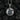 Oxidized silver St Michael medallion necklace featuring detailed relief and stone setting