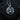 Front view of handcrafted silver tiger pendant showing intricate fur details and oxidized finish on medallion