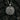 Angled view of handcrafted silver wolf fox pendant highlighting the beaded rim and yin yang composition