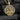 Close-up of Good Shepherd pendant highlighting intricate filigree details and oxidized finish on charcoal