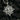 Angled shot of handcrafted silver sun god pendant highlighting depth and jewelry craftsmanship