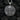 Close-up of screaming skull and skeletal hands holding guns on a handcrafted medallion pendant design