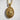 Detailed view of the oxidized silver Saint Boniface pendant resting against a textured white stone background.