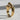Close-up of the handcrafted reading girl ring highlighting the detailed open book and elegant flowing dress design