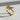 Detailed macro view of the sparkling stones and gold wings on the diamond butterfly ring casting a gentle shadow.