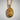 Saint James Pilgrim Pendant, gold vermeil, front view against white wall