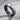 Oxidized silver double band ring showcasing dark metallic finish and brilliant inset stones on a textured surface