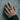 Gothic Quatrefoil Ornament Ring, worn on model hand against concrete wall