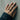 Interlaced Star Ring, worn on model hand against concrete wall