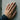Bypass Solitaire Ring worn on model hand against concrete wall