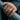 Men's Masonic signet ring in gold vermeil worn on a hand gripping a metal bar, showcasing bold statement design.