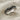 Ruby Eye Serpent Ring, oxidized silver, angled close-up view on linen