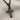 Beveled Ankh Pendant, black rhodium, angled view on fabric