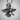 Close-up of handcrafted enamel bee pendant in oxidized silver highlighting intricate body textures and sturdy bale