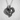 Close-up angled view of handcrafted horse heart pendant highlighting the deep oxidized silver textures and curves.