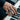 Lifestyle photo of a man playing piano while wearing the oxidized silver POW MIA memorial ring on his hand