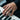 Men's oxidized silver Semper Fidelis ring worn on hand playing a piano keyboard showing everyday masculine style