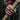 Lifestyle view of the oxidized silver God Pan ring worn on a man's hand firmly gripping a wooden axe handle