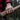 Man's hand gripping a wooden axe handle while wearing the rugged oxidized silver textured scale ring