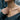 Woman wearing the elegant 925 sterling silver equality bar pendant layered gracefully on her bare collarbone.