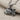Oxidized 925 sterling silver goldfish pendant resting on textured fabric highlighting its deep contrast details