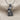 Crowned Horus Pendant, oxidized, on textured fabric
