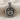 Facing Gemini Twins Pendant, product photo displayed on textured linen