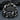Close-up of handcrafted silver broken chain ring on dark stone displaying heavy industrial links and patina.