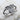 Love Heart Ring, angled three-quarter view on textured stone surface
