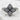 Close-up angled view of the oxidized silver vintage lotus ring resting on white stone, highlighting the intricate pave.