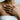 Clasping hands ring worn on model, two-tone finish on hand