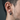 Side profile of oxidized silver industrial hoop earring worn on ear showing sleek segmented architectural design