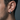 Side view of chunky geometric hoop earring worn on a male model showcasing the oxidized silver brushed matte finish