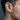 Close-up of modern geometric hoop earring worn by a male model showcasing the chunky brutalist design