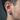 Close-up of men's rope hoop earring worn on ear demonstrating the thick brushed silver profile and secure fit