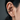 Close-up of oxidized silver olive branch ear cuff worn securely on cartilage without piercing on model