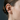 Profile view of the two-tone fish ear cuff securely worn on a model's upper ear cartilage without any piercing