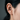 Close-up of the two-tone lightning bolt earring worn securely on the upper ear cartilage without a piercing