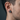 Side profile of a man wearing the oxidized silver Spartan helmet earring showcasing its 11mm size and fit