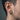 Side profile of modern grooved hoop earring worn on ear demonstrating clean minimalist daily styling
