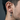 Side view of male model wearing the oxidized silver gothic cross hoop earring showing architectural details